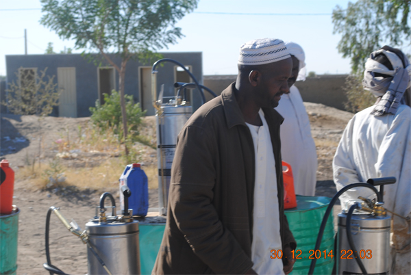 Kamal, the clinic supervisor, kickstarts the spraying campaign at the school